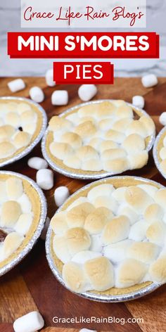 mini s'mores pies on a wooden table with marshmallows