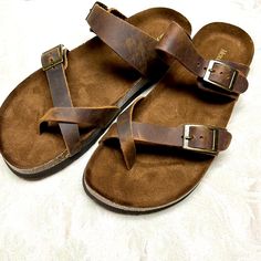 These Mountain Sole Slip-On Sandals Feature A Crisscross All Leather Strap That Fits Around The Toe And A Molded, Faux Suede Lined, Cork-Wrapped Footbed For Comfort And Support. Leather Has Natural Imperfections On The Surface. Color: Brown 1" Heel Height Contoured Footbed With Heel Cup Leather Upper/Remainder Man Made Two Adjustable Buckles Easy Slip-On Eva Outsole New Without Tags Casual Sandals With Cross Strap And Heel Loop, Casual Sandals With Heel Loop And Cross Strap, Casual Leather Toe Loop Footbed Sandals, Leather Cross Strap Sandals With Textured Footbed, Adjustable Leather Sandals With Cross Strap, Adjustable Leather Cross Strap Sandals, Leather Footbed Sandals With Cross Strap, Leather Footbed Cross Strap Sandals For Beach, Casual Footbed Sandals With Leather Sole And Toe Loop