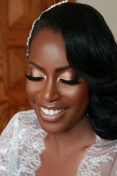 a woman with black hair wearing a wedding dress