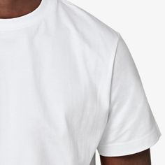 This white crewneck T-shirt boasts a "straight" fit that lends a modern aesthetic to your style. Sport it as a base layer or roll up the sleeves & keep it classic with jeans or shorts. White Relaxed Fit Basic T-shirt, Classic T-shirt With Straight Hem And Relaxed Fit, Simple Everyday Shirt With Crew Neck, White Classic Top With Straight Hem, Modern Crew Neck T-shirt For Everyday, Modern White T-shirt For Everyday, Minimalist Cotton Tops For Streetwear, Modern White Cotton T-shirt, Basic White Crew Neck Tops