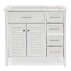 a white bathroom vanity with drawers and doors