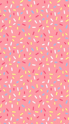 a pink background with colorful sprinkles on it