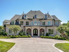 a large brick house with lots of windows