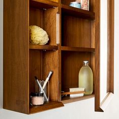 a wooden shelf with some items in it