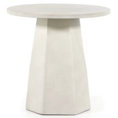 a white table with a circular top on a white background, it appears to be made from concrete