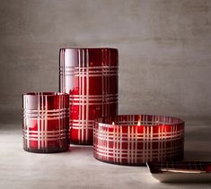 three red candles sitting next to each other