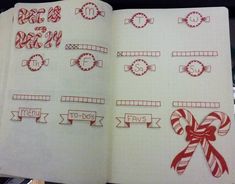 an open notebook with christmas stickers and ribbons on the pages, including candy canes