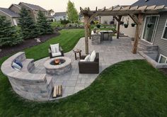 an outdoor patio with seating and fire pit