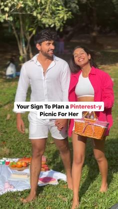 a man and woman standing next to each other in front of a picnic blanket with the words your sign to plan a pinterest - y picnic for her