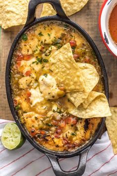 tortilla soup in a cast iron skillet with tortilla chips on the side