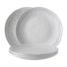 three white plates with silver trims on the edges and one has an oval design