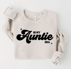 "In My Aunt Era - Era Sweatshirt - Aunt Era Crewneck - In my Era - Mama Sweatshirt - Era Crewneck - Auntie Era - Bella Canvas Sweatshirt Celebrate the love and influence of incredible aunties with our \"In My Auntie Era\" Sweatshirt. This stylish and cozy garment serves as a heartfelt tribute to the special role aunties play in our lives, capturing the essence of a cherished era when aunties brought joy, guidance, and laughter. + | SIZING | Shirts are Bella Canvas Unisex and run true to size. Pl Auntie Sweatshirt With Names, In My Auntie Era, Auntie Aesthetic, Aunt Things, Masculine Fits, Auntie Era, In My Era