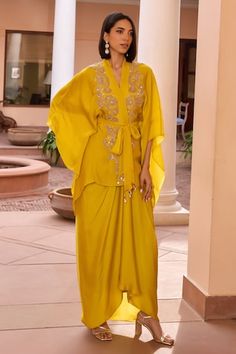 Yellow kimono top with tilla, dori, brass bead and sequins embroidery. Comes with an asymmetric draped skirt, a bustier and a belt. - Aza Fashions Dhoti Design, Haldi Dresses, Kimono Skirt, Isha Gupta, Western Party Wear, Diwali 2024, Bollywood Beautiful, Yellow Kimono, Western Party