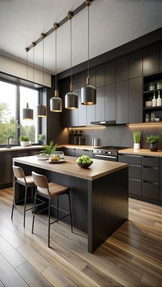 a modern kitchen with wooden floors and dark colored cabinetry, along with hanging lights