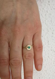 Vintage style gold ring with tiny green emerald stone 14K Gold ring Yellow gold Birthstone ring, Solid gold ring, Organic shape ring This dainty 14k Gold stackable Ring is made from 14k solid gold (you can choose 14k or 9k) it has an organic circle disc shape and features a green emerald gemstone that is bezel set in the center, Emerald is the birthstone for May, they are considered to be a symbol of rebirth and love. Delicate and minimalist, an excellent choice for anniversary gift, promise rin Gold Rings Stackable, Solid Gold Ring, Solid Gold Rings, Emerald Stone, Stackable Ring, 14k Gold Ring, Emerald Gemstone, Green Emerald, Birthstone Ring