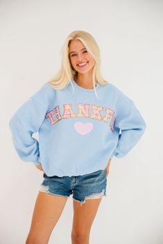 Wrap yourself in gratitude with our Thankful Blue Pullover! This playful pullover features a pastel plaid design and bold Thankful letters, along with a cute pink heart patch. Be cozy and stylish while showing your appreciation! All orders are currently shipping within 14 business days. To receive item quicker, expedited shipping is available at checkout. **ALL THANKSGIVING ORDERS MUST BE PLACED WITH EXPEDITED SHIPPING TO GUARANTEE DELIVERY BY NOV. 27 IF PLACED AFTER NOV. 15** Trendy Light Blue Fall Sweatshirt, Trendy Light Blue Sweatshirt For Fall, Light Blue Letter Print Sweatshirt For Fall, Blue Playful Fall Sweatshirt, Playful Blue Fall Sweatshirt, Playful Blue Sweatshirt For Fall, Cute Blue Sweatshirt With Relaxed Fit, Cute Pink Heart, Pastel Plaid