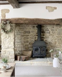 a wood burning stove sitting inside of a living room