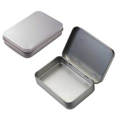 two tins with one open and the other empty on a white background, each containing an individual's own piece of food