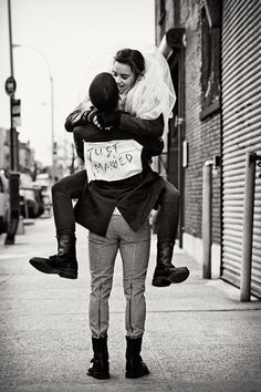 a woman carrying a child on her back