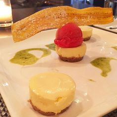 three small desserts on a white plate