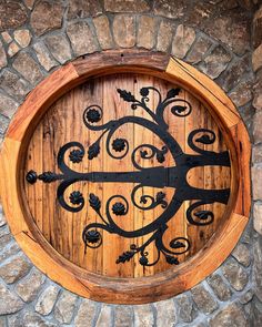 a circular wooden window with wrought iron work