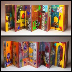 an open book with colorful paintings on the cover and inside pages folded in different directions