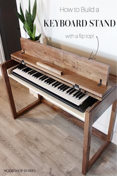 a wooden piano sitting on top of a hard wood floor next to a potted plant