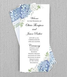 blue hydrangeas and white flowers are on the front of this wedding program