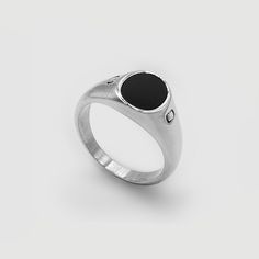 Onyx is a protector stone: Renowned for enhancing both self-confidence and discipline. CRAFTD for any occasion. This Silver Signet Ring showcases a solid Oval Onyx, hand-set within a premium Cabochon inlay: an expert technique known for unlocking the gemstone's richest and deepest natural colour.Its classic design, paired with an ultra-durable, scratch-resistant band, makes it a lasting and versatile addition to any collection—the perfect choice for morning, noon, and night. ✓ Rhodium & 316L Sta Luxury Silver Signet Ring With Oval Cabochon, Silver Oval Cabochon Signet Ring With Polished Finish, Oval Onyx Signet Ring With Gemstone, Silver Onyx Signet Ring Luxury Style, Silver Onyx Signet Ring With Polished Finish, Ice Necklace, Pearl Shop, Silver Signet Ring, Oval Stone