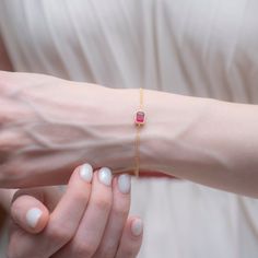 Introducing our exquisite Ruby Rectangle Bracelet, a stunning piece of jewelry crafted from luxurious 14K solid gold. This elegant bracelet showcases a vibrant ruby, the birthstone for July, symbolizing passion and love. Perfectly designed to enhance any outfit, from casual to formal, this bracelet is a true statement piece that radiates warmth and beauty. The radiant ruby is securely set within a sleek rectangular frame, which not only adds sophistication but also highlights the gemstone's rich Anniversary Ruby Jewelry With Rectangular Stone, Fine Jewelry Ruby Ring, Rectangular For Formal Occasions, Classic Rectangular Ruby Jewelry, Gold Ruby Bracelet Fine Jewelry, Luxury Elegant Ruby Bracelet, Ruby Bracelet, Ruby Necklace, Ruby Earrings, Elegant Bracelet