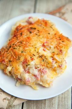 ham and cheese hashbrown casserole on a white plate with text overlay