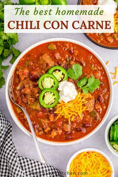 the best homemade chili con carne in a bowl with sour cream and jalapenos