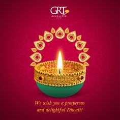 a happy diwali greeting card with a lit candle