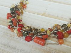 This gorgeous Multi-Strand necklace was crocheted by hand using 100% linen thread and red, yellow, brown, and green stones. Multi stones necklace is feminine, fun, and luxurious to wear for any occasion. Length: 22" (56 cm) All my jewelry are gift-packed ready to be given as a gift to a person that you love or keep to yourself. To all my jewelry in my shop: https://www.etsy.com/shop/Rozmari?ref=pr_shop_more Please use all pictures as a guideline only. The product's screen color will vary slightl Necklaces Colorful, Keep To Yourself, Rustic Necklace, Boho Chic Necklace, Linen Thread, Stones Necklace, Colorful Necklace, Chic Necklace, Screen Color