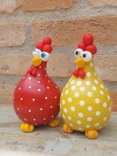 two ceramic chickens sitting next to each other