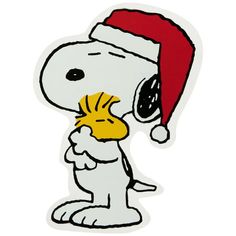 a snoopy christmas sticker with a santa hat on