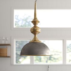 a light fixture hanging from the ceiling in a kitchen