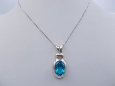 "This is a vintage sterling silver & blue topaz stone pendant necklace. A fine silver chain holds an oval pendant which has a pretty faceted blue topaz inset. This necklace is 20\" long." Silver Oval Blue Topaz Pendant Jewelry, Silver Blue Topaz Oval Pendant Jewelry, Silver Oval Pendant Jewelry With Blue Topaz, Silver Blue Topaz Oval Pendant Necklace, Silver Oval Topaz Necklaces, Vintage Pendant Necklace, Art Deco Pendant, Blue Topaz Stone, Vintage Pendant