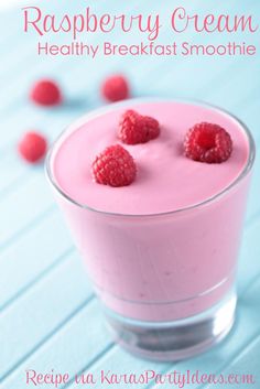 raspberry yogurt in a glass with berries on the side