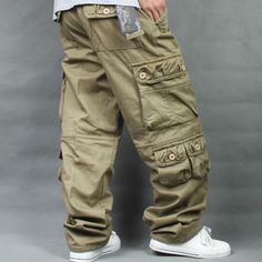 These cargo pants are a great inspiration for anyone who wants cozy trousers. Fashioned of good quality cotton, these mid-waist pants will add style to your look and keep you comfortable throughout the day. The loose-fit pants will complement your hip-hop style in the best way. These pants will get you smiling. Pants For Men Casual, Loose Cargo Pants, Mens Bottoms, Cargo Pants For Men, Mid Waist Pants, Trousers Men, Baggy Cargo Pants, Style Hip Hop, Estilo Hip Hop