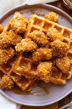 fried chicken and waffles on a plate with syrup