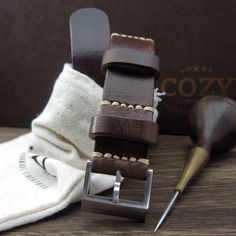 "At Cozy Handmade, we pride ourselves on using the highest quality materials for our products. This NAT2 watch strap is made of premium full grain Italian veg tanned leather from one of the best tanneries in Italy. The leather features gorgeous texture and natural characteristics which will give your watch an instant rugged and vintage stylish look. Its appearance will get even better with time as it acquires patina, wrinkles and marks. The color of Military 103 is a combination of different sha Everyday Leather Bracelet With Waxed Finish, Rugged Leather Watch Bands For Everyday Use, Vintage Leather Watch Accessories For Everyday Use, Rugged Leather Strap Watch Accessories For Everyday Use, Rugged Waxed Finish Watch Bands For Everyday Use, Rugged Watch Accessories With Leather Strap For Everyday Use, Leather Watch Accessories With Adjustable Strap For Everyday Use, Everyday Vintage Brown Leather Watch Band, Vintage Brown Leather Watch Bands For Everyday Use