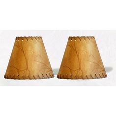 two wooden lampshades sitting next to each other