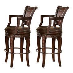 two brown leather bar stools sitting next to each other