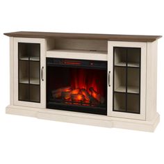 an entertainment center with a fire place and glass doors on the front, in white