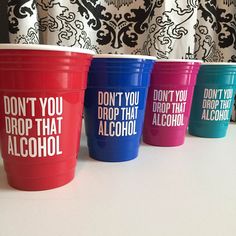 four colorful cups with don't you drop that alcohol written on the side in different colors