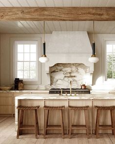 a kitchen with marble counter tops and stools in front of an island that has three lights hanging from the ceiling