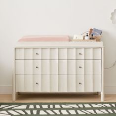 a baby crib in a white nursery room