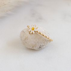 Adorable flower ring with a tiny white daisy and texture band. Wear it by itself for a minimal look or add it to your ring stack for extra texture DETAILS: - Waterproof, PVD plated stainless steel - daisy : 5mm - band width : 1 mm Dainty Stackable Toe Ring, Dainty Stackable Toe Flower Ring, Adjustable Dainty Flower Midi Rings, Dainty Flower Rings For Spring, Dainty Hypoallergenic Flower Ring For A Promise, Minimalist White Adjustable Flower Ring, Dainty Adjustable Flower Stackable Rings, Dainty Adjustable Stackable Flower Ring, Dainty Daisy Hypoallergenic Jewelry