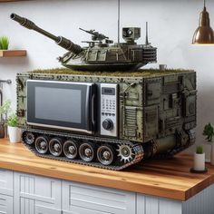 a microwave oven sitting on top of a tank shaped like a tank with tanks on it